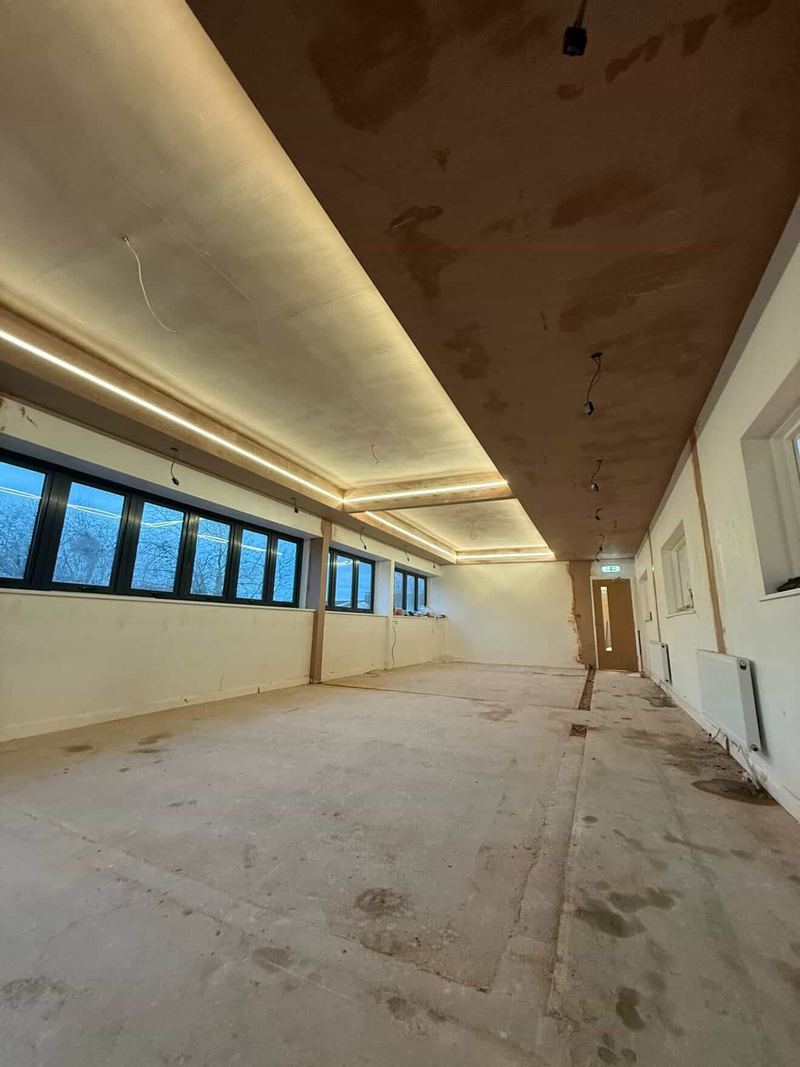 A lighting halo formed in the raised ceiling of a Pilates studio in Warwick